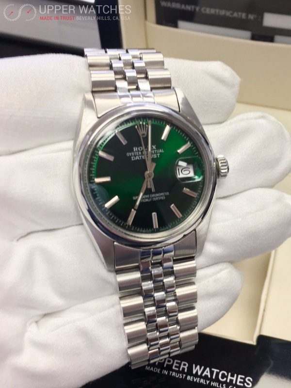 silver rolex with green face