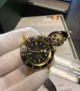 06-rolex-1680-gold-submariner-black-dial-faded-bezel