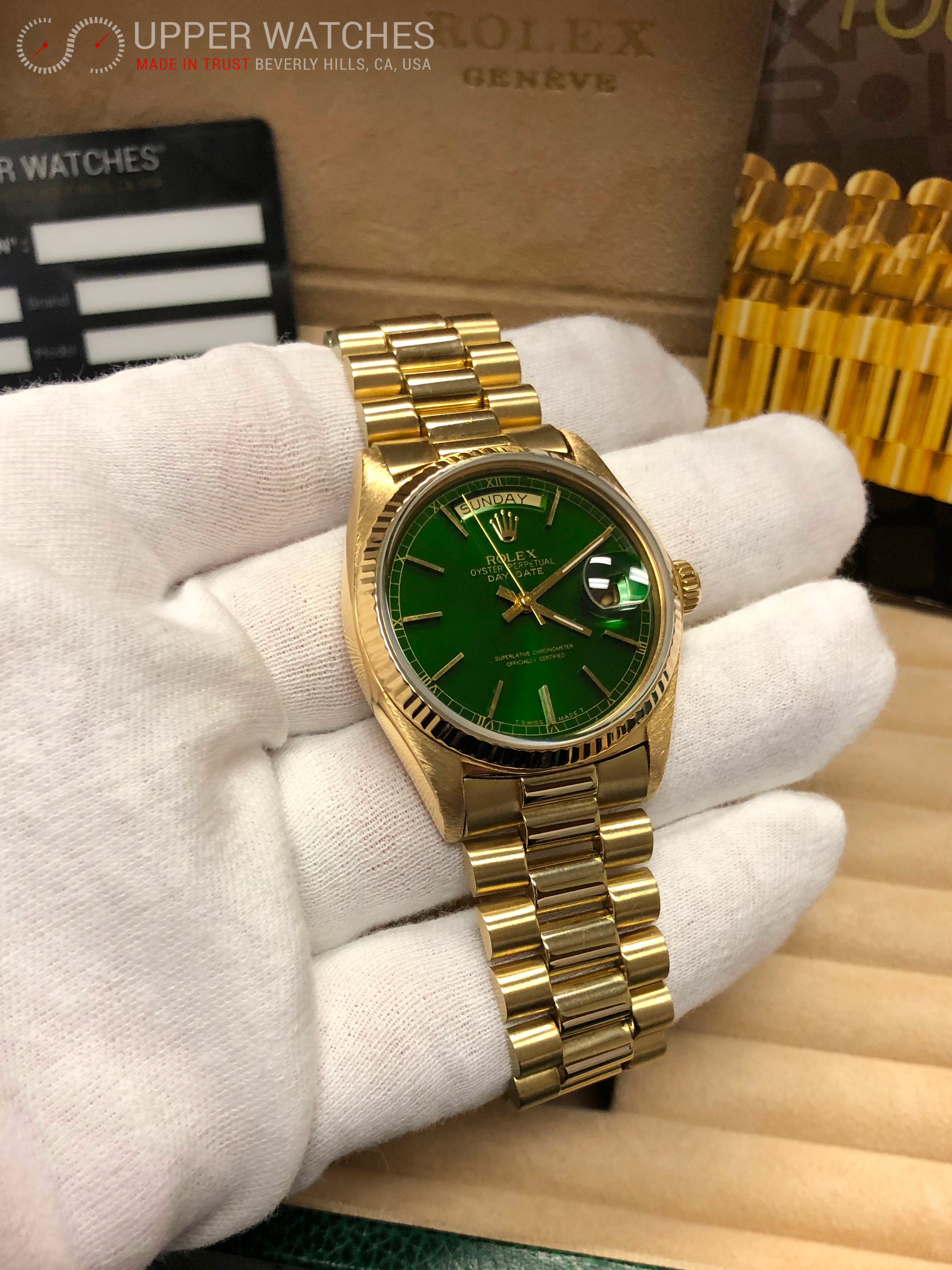 gold rolex with green dial